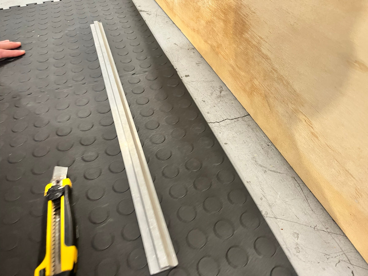 Tools beside garage floor tiles during installation